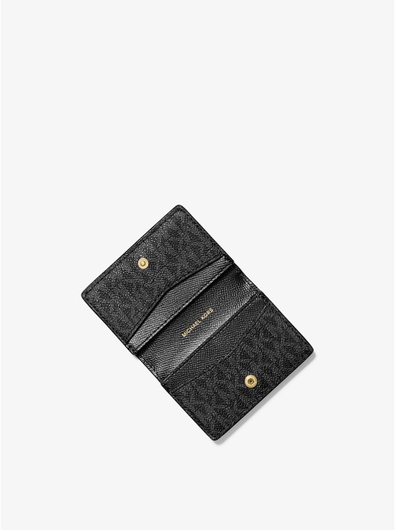 Каталог Маленький двухцветный кошелек с логотипом от магазина Michael Kors